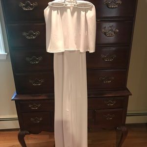 White Jumpsuit (pictured in middle)